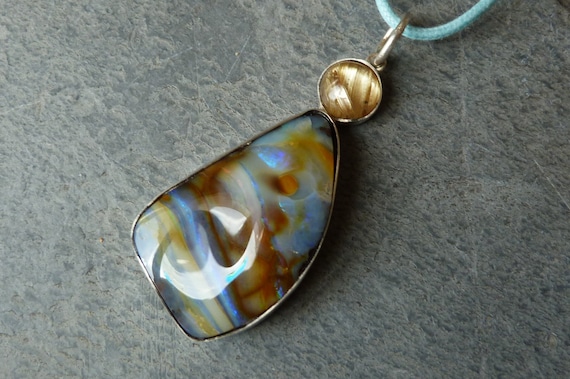Silver pendant with 1 rutil quartz and a boulder opal: IMPORTANT,French vat is included, 20% off for US,UK and canadian buyers