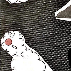 May include: Two white stitched fabric figures with red circles for noses. The figures are lying on a black textured surface.