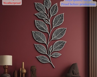 Puede incluir: Un gran adorno de pared de metal con forma de hoja y un diseño detallado de venas. La hoja está pintada en un color claro y montada sobre una pared de color rojo oscuro. El texto en la imagen dice "Color Options Weatherproof" y "Fast and free shipping High quality metal Proof before production".