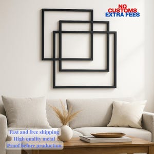 May include: Black metal wall art featuring three overlapping square frames. The artwork is mounted on a white wall above a beige sofa with decorative pillows. The text "NO CUSTOMS EXTRA FEES" is visible.