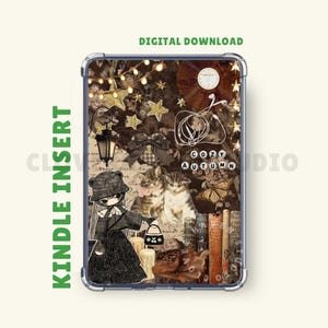 May include: A rectangular Kindle insert featuring a collage of brown-toned imagery including a cartoon character in a hat, two kittens, a lantern, string lights, stars, a vinyl record, wired earbuds, books, and the text COZY AUTUMN.
