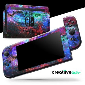 May include: Nintendo Switch console and controllers with a galaxy-themed skin. The skin features a vibrant mix of blue, purple, red, and green colors, resembling a nebula. The console and controllers are displayed on a white background.