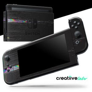 May include: A black Nintendo Switch console and controllers with a glitch effect design. The console has the Nintendo Switch logo and the text "creatiive labs" in the bottom right corner.