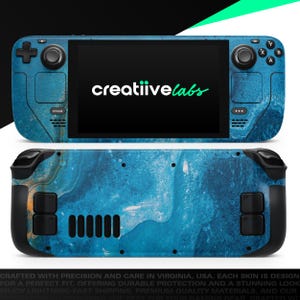 May include: A blue and white marbled skin for a handheld gaming device, featuring the text "creatiivelabs" on the screen. The device has black buttons and controls, with the word "STEAM" visible. The skin covers the front and back of the device.