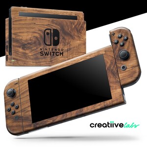 May include: A Nintendo Switch console and controllers featuring a wood grain effect. The console and controllers have a dark brown finish with a black screen and buttons. The Nintendo Switch logo is displayed on the console.