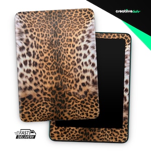 May include: A tablet case and tablet with a leopard print design. The case is detached from the tablet, revealing the black screen. The leopard print features brown and black spots on a tan background. The words "FAST DELIVERY" are printed on the bottom left.