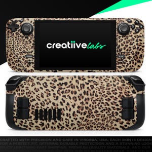 May include: A handheld gaming device with a leopard print skin. The device has black buttons and a screen displaying the text "creatiivelabs" in white and green. The Steam logo is visible on the left side.