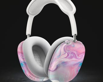 May include: White wireless headphones with a pink and blue marbled design on the earcups.