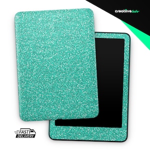 May include: A teal glitter tablet case with a matching cover, open to reveal the black screen of the tablet. The case is rectangular with rounded corners. The words "FAST DELIVERY" are printed on a black and white graphic.