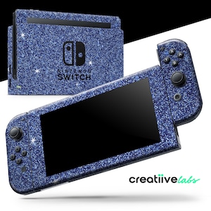 May include: A Nintendo Switch console and controllers with a blue glitter design. The console and controllers have a black screen and buttons. The text "Nintendo Switch" is visible on the console.