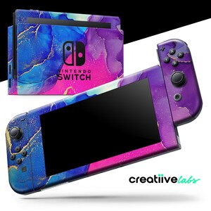 May include: A Nintendo Switch console and controllers with a vibrant, abstract design. The design features swirls of blue, purple, pink, and gold. The console and controllers are displayed against a white background.
