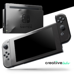 May include: A black Nintendo Switch console with a gray screen and black controllers. The console is shown with its docking station. The text "NINTENDO SWITCH" is visible on the dock. The image also includes the text "creatiivelabs".