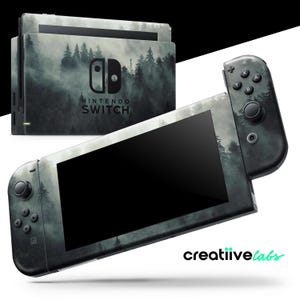 May include: A Nintendo Switch console and controllers featuring a forest design. The console and controllers are adorned with a dark grey and white forest scene. The Nintendo Switch logo is displayed on the console. The brand "creatiivelabs" is in the bottom right corner.