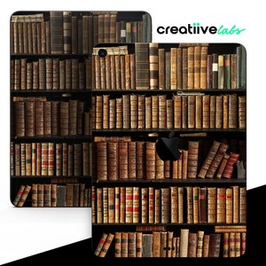 May include: A black and white iPad case with a design of a bookshelf filled with old, leather-bound books.