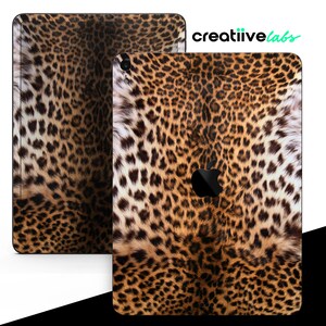 May include: A leopard print iPad skin with a black border. The skin is made of a durable, high-quality material and is designed to protect your iPad from scratches and bumps.