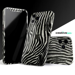 May include: Three iPhone cases with a zebra print design. The cases are black and white with a textured zebra pattern.