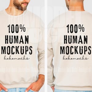 May include: A beige sweatshirt with long sleeves and a crew neck. The front and back of the sweatshirt have the text "100% HUMAN MOCKUPS kokomacks" printed in black.