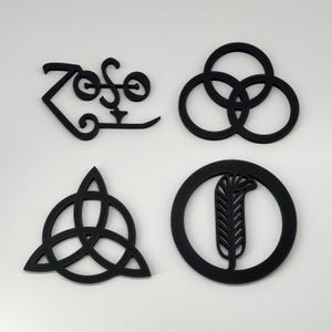 May include: Four black metal logos, each representing a different band. The logos are: "Zoso", a circle with three overlapping circles, a triangle with three overlapping triangles, and a circle with a feather inside.