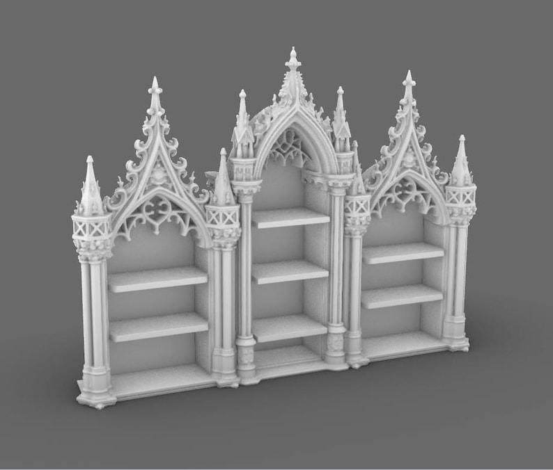 May include: A white, ornate bookshelf with three sections, each with shelves. The design features Gothic architectural elements, including pointed arches, spires, and intricate tracery. The bookshelf is a decorative storage unit.