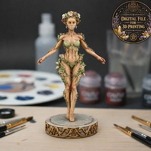 May include: A detailed figurine of a woman adorned with leaves and flowers, standing on a decorative base. The figure has a floral crown and is painted in natural tones. The image includes the text "DIGITAL FILE FOR 3D PRINTING".