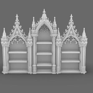 May include: A white, ornate bookshelf with a gothic architectural design. The bookshelf features multiple shelves and intricate detailing, including pointed arches and decorative spires. The overall design is symmetrical and detailed.