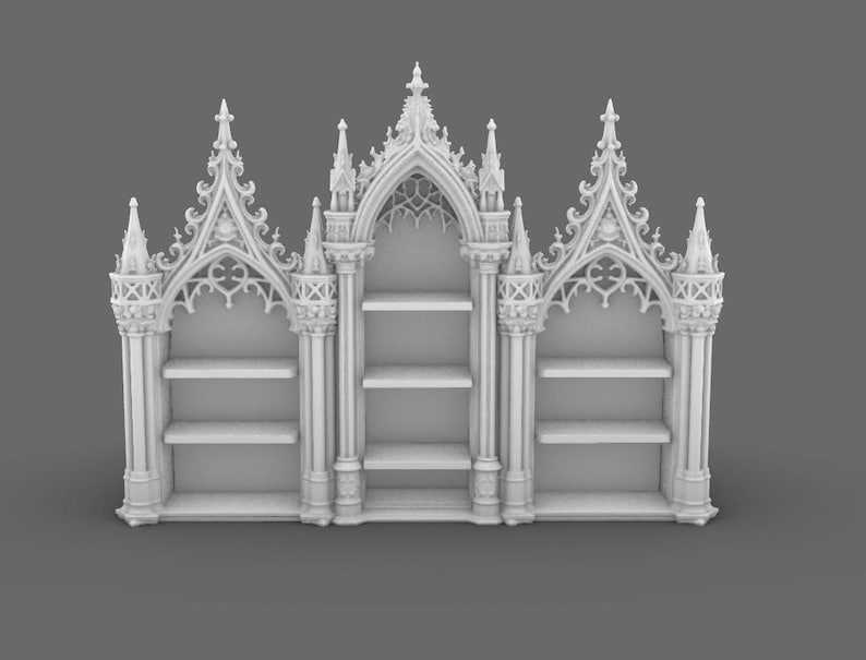 May include: A white, ornate bookshelf with a gothic architectural design. The bookshelf features multiple shelves and intricate detailing, including pointed arches and decorative spires. The overall design is symmetrical and detailed.