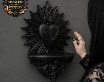 May include: Black wall-mounted shelf with a heart-shaped design and a sunburst background. The shelf has a small ledge and ornate detailing. The image includes a circular graphic with the text "DIGITAL FILE FOR 3D PRINTING".