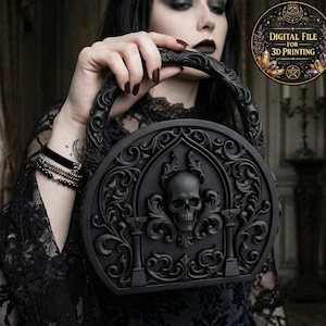 May include: Black, round handbag with a skull and ornate details. The bag has a handle and is held by a person. The image includes a circular graphic that says "DIGITAL FILE FOR 3D PRINTING".