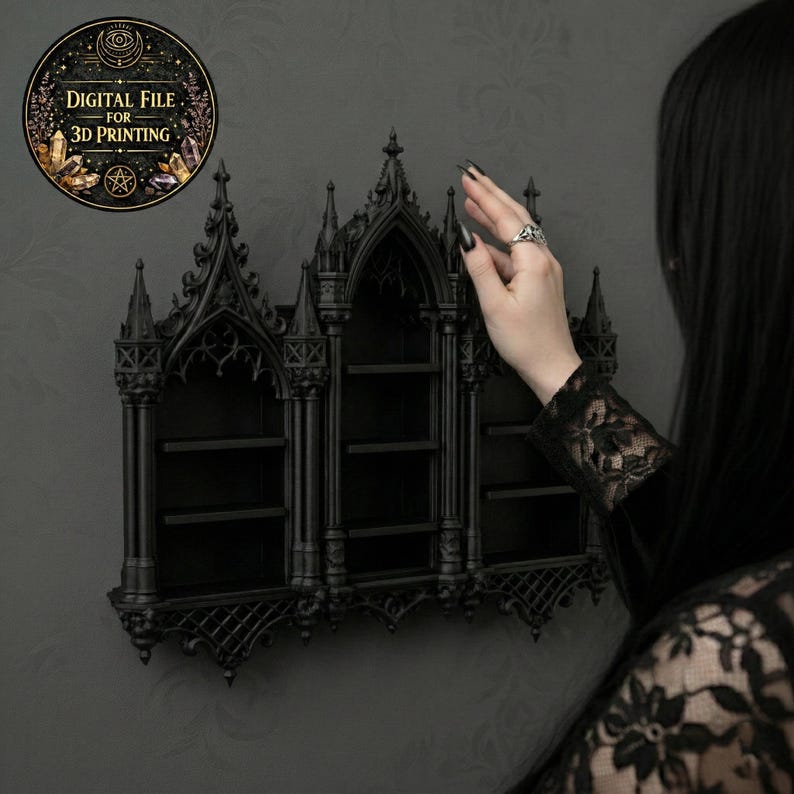 May include: A black gothic-style wall shelf with three compartments. The shelf has an ornate design with pointed arches and decorative elements. A circular sticker with the text "DIGITAL FILE FOR 3D PRINTING" is in the upper left corner.