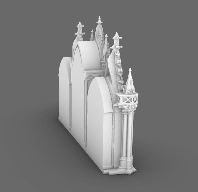 May include: A white, architectural model of a cathedral or church, featuring arched windows, spires, and decorative columns. The model has a detailed design with intricate carvings and a gothic style.