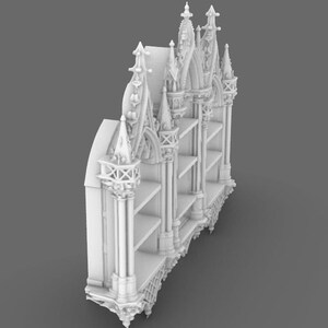 May include: A white, ornate bookshelf with a gothic architectural design. The bookshelf features multiple shelves and decorative spires, arches, and columns. The overall design is symmetrical and detailed, with a focus on intricate carvings and pointed elements.