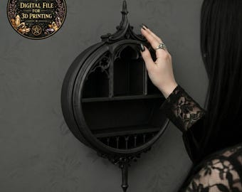 May include: A black, gothic-style wall shelf with a circular design. The shelf has two interior shelves and decorative pointed arches. The image includes a circular sticker that says "DIGITAL FILE FOR 3D PRINTING".