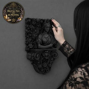 May include: Black wall decor featuring a classical bust surrounded by floral elements. The sculpture is mounted on a wall. A circular graphic with the text "DIGITAL FILE FOR 3D PRINTING" is in the upper left corner.