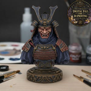 May include: A detailed bust of a samurai warrior, with a fierce expression and ornate armour. The figure is mainly blue, red, and bronze, with a detailed helmet and facial features. The image includes the text "DIGITAL FILE FOR 3D PRINTING".
