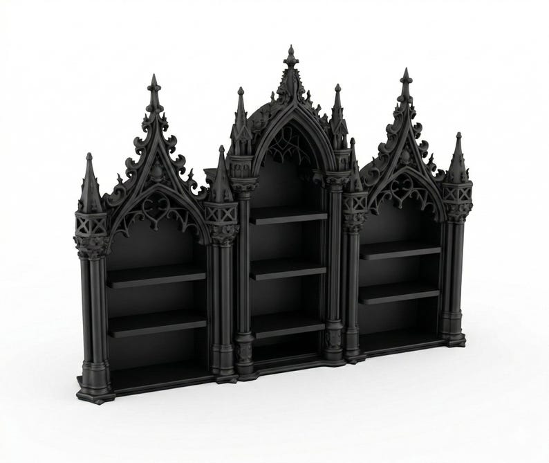 May include: A black gothic-style bookshelf with three sections. Each section has shelves for storage. The bookshelf features intricate architectural details, including pointed arches and decorative spires, creating a dramatic and ornate appearance.