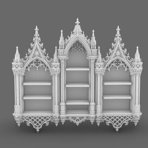 May include: A white, ornate bookshelf with a gothic architectural design. The bookshelf features three sections, each with shelves for storage. The top and bottom of the bookshelf have intricate, decorative patterns, and the overall design is symmetrical.
