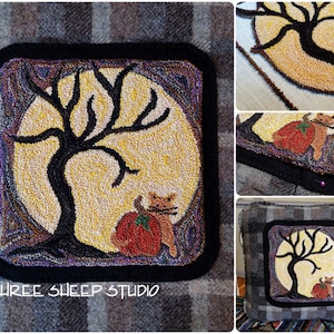 May include: A square, handmade rug with a Halloween theme. The rug features a black tree silhouette against a yellow moon, a cat, and a pumpkin. The rug is framed with a black border and the text "THREE SHEEP STUDIO".