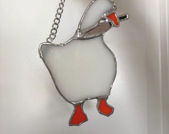 Atrapasol de ganso con cuchillo en vitral