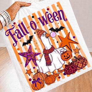 May include: A white fabric featuring the purple text Fall-o-ween, a goose wearing a patterned hat and scarf blowing a pink bubble, black bats, orange and purple stars, and various pumpkins with plaid, polka dot, and solid orange patterns.