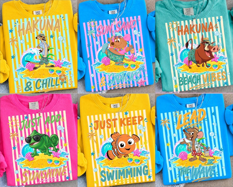 May include: A collection of colorful sweatshirts featuring cartoon characters and beach-themed phrases. Designs include "Hakuna & Chill," "Sun, Sand, Snacks," and "Just Keep Swimming." Each shirt has a unique character illustration and striped background.