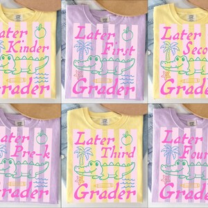 May include: Six colorful t-shirts with school-themed designs. Each shirt features the words "Later" and "Grader" with a grade level, a cartoon alligator, and other graphics. The shirts are yellow and purple.