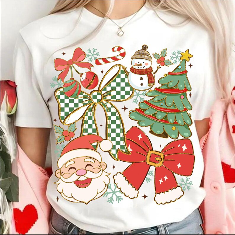 May include: White t-shirt featuring a festive Christmas design. The graphic includes a snowman, Christmas tree, Santa Claus, bows, and ornaments in red, green, and white. The design is embellished with snowflakes and stars.