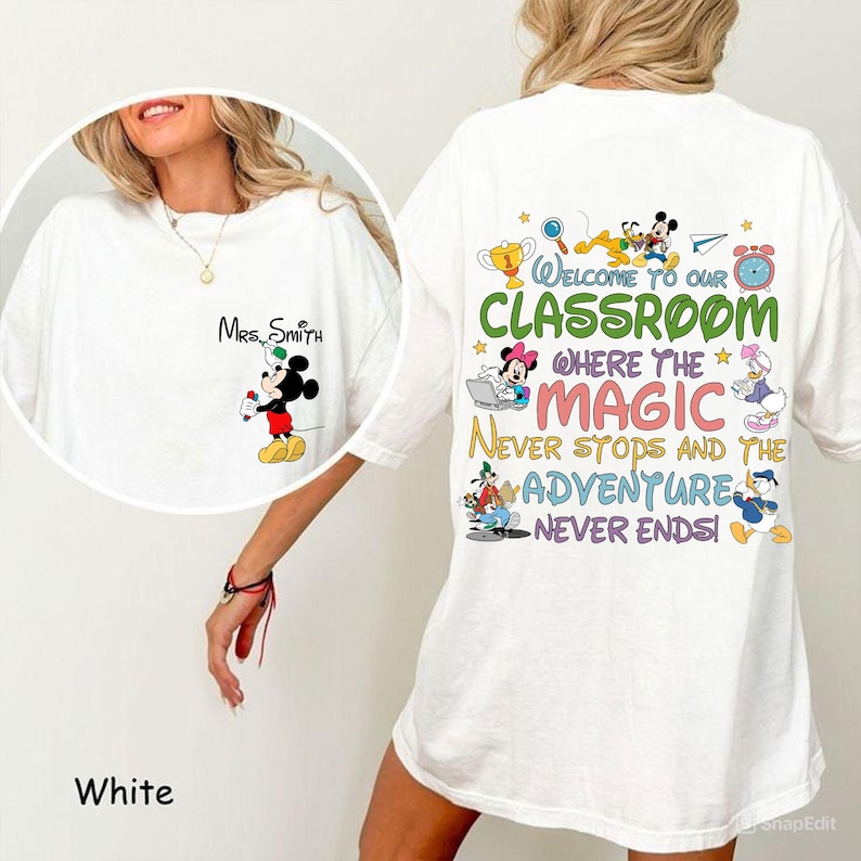 May include: White t-shirt featuring Mickey Mouse holding a pen with "Mrs. Smith" above. The back of the shirt has the text "Welcome to our Classroom" with various Disney characters and the phrases "Where the Magic Never Stops and the Adventure Never Ends!"