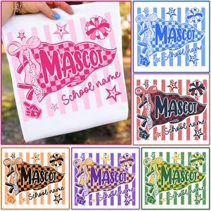 May include: A white t-shirt featuring a graphic of a checkered pennant flag with the text MASCOT and School name, accented by a large bow, a pom-pom, and a foam finger. The design is shown in six color variations: pink, blue, red, orange, purple, and green.