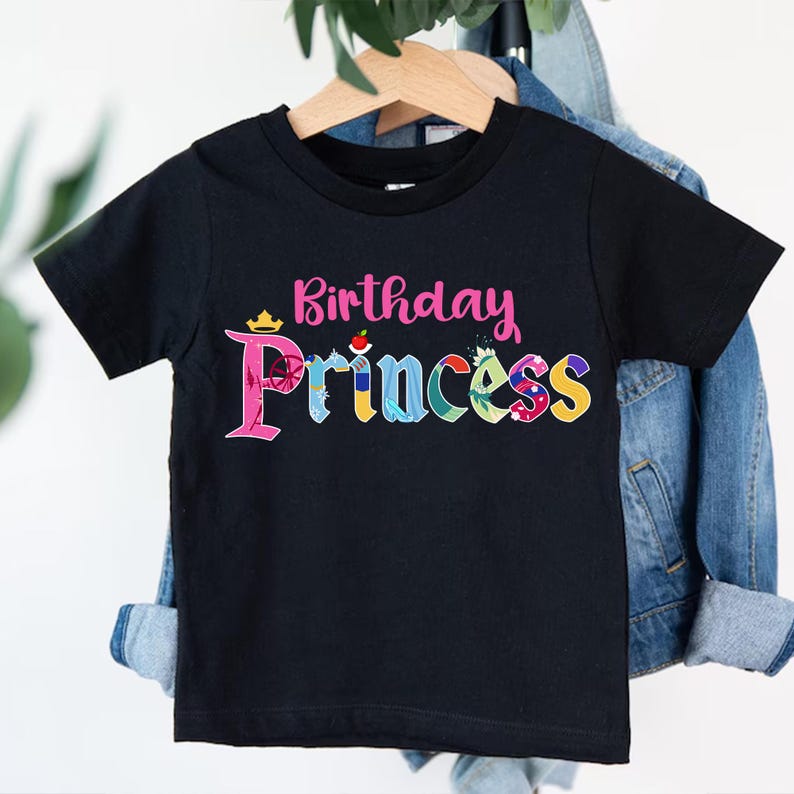 May include: Black t-shirt with the text "Birthday Princess" in colorful letters with Disney princess icons.