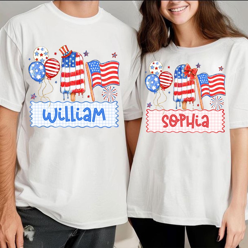 May include: White t-shirts with patriotic designs. One shirt features the name "William" in blue, and the other says "Sophia" in red. Each shirt has a popsicle, balloons, and an American flag design.