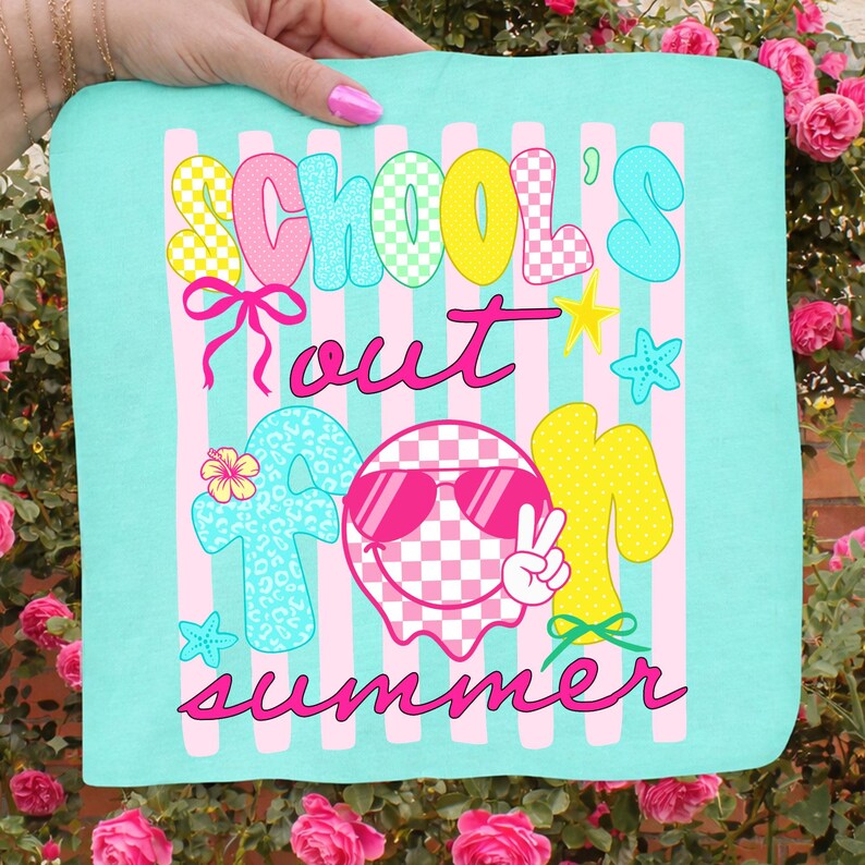 May include: A turquoise square textile with the words "SCHOOL'S OUT FOR SUMMER" in a playful font. The design includes pink stripes, a smiley face wearing sunglasses, stars, and bows. The text and graphics are in various colors.