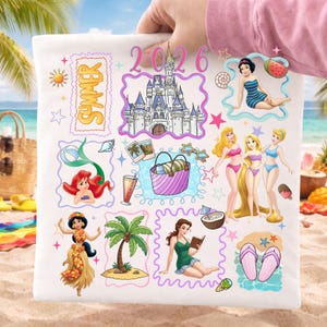 May include: White tote bag featuring colorful illustrations of Disney princesses, a castle, and summer-themed elements. The design includes the word "Summer" and the year "2026". The bag is held up against a beach background.