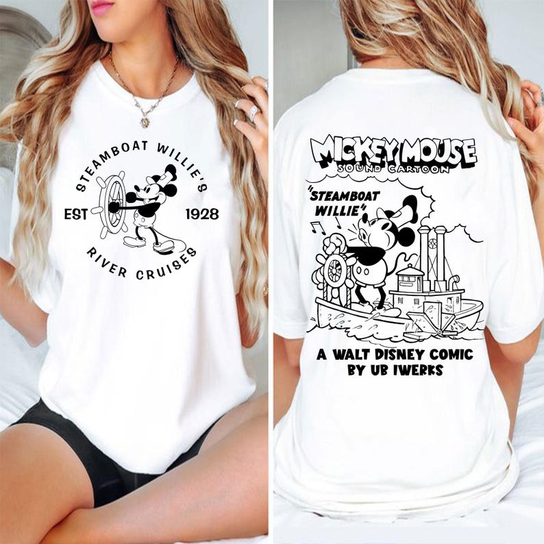 May include: White t-shirt featuring a black and white illustration of Mickey Mouse on a steamboat. The text "Mickey Mouse Sound Cartoon" is above the illustration. The text "Steamboat Willie" is below the illustration. The text "A Walt Disney Comic by Ub Iwerks" is below the illustration.