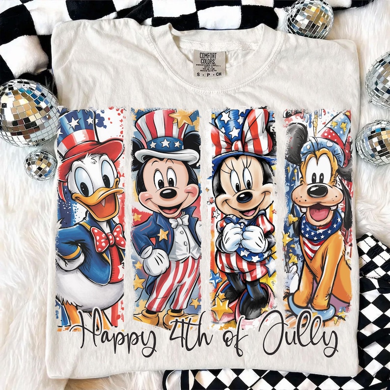 May include: Cream-colored t-shirt featuring Donald Duck, Mickey Mouse, Minnie Mouse, and Pluto in patriotic attire. The graphic includes red, white, and blue colors, with the text "Happy 4th of July". The shirt is a Comfort Colors brand.
